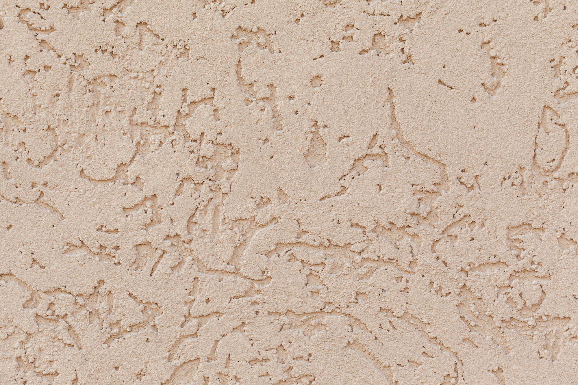 Warm troweled plaster surface in soft light